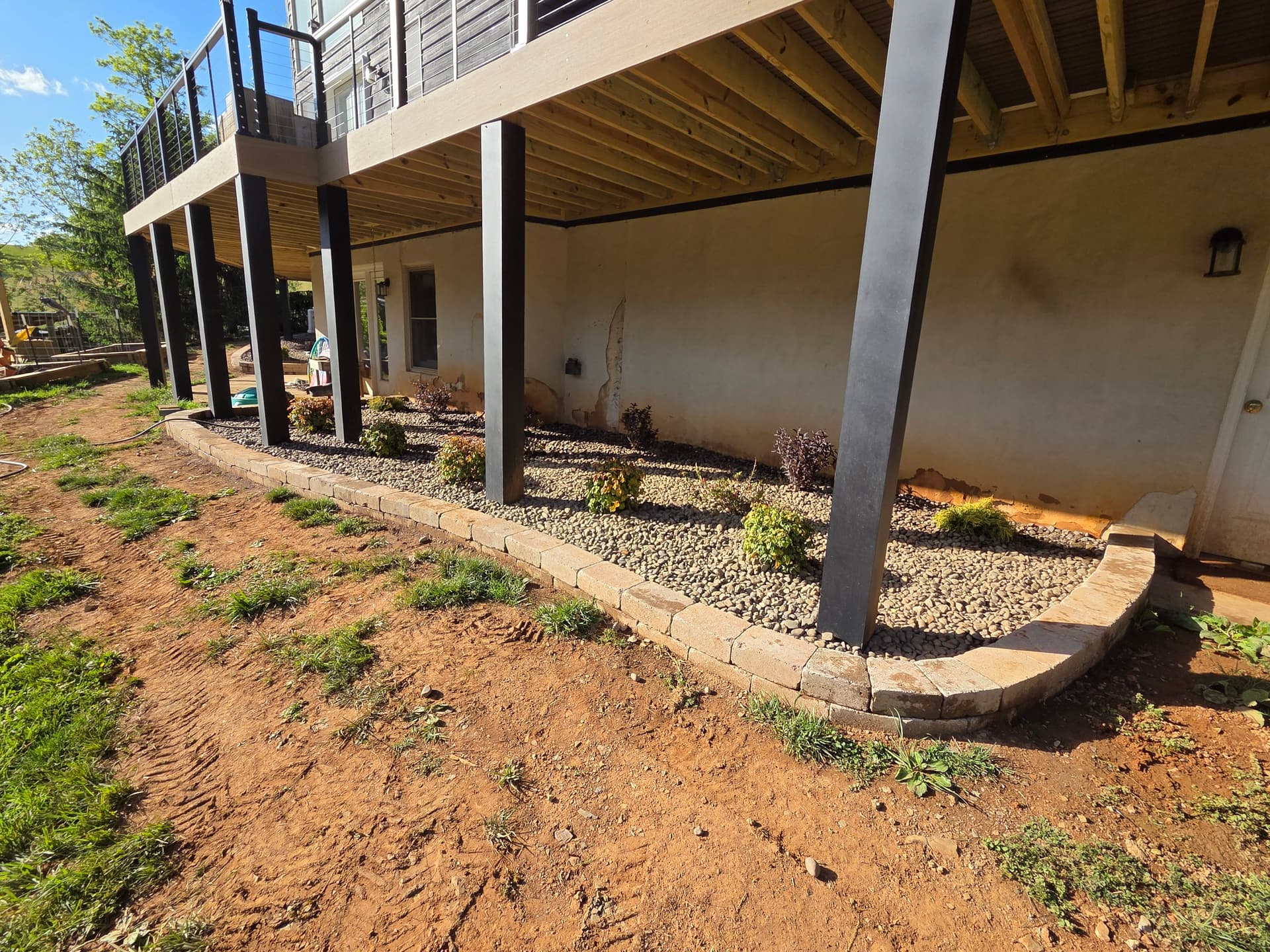 Gallery photos for Clean Landscape Border and Decorative Stone Bed Under a Deck: Image #1